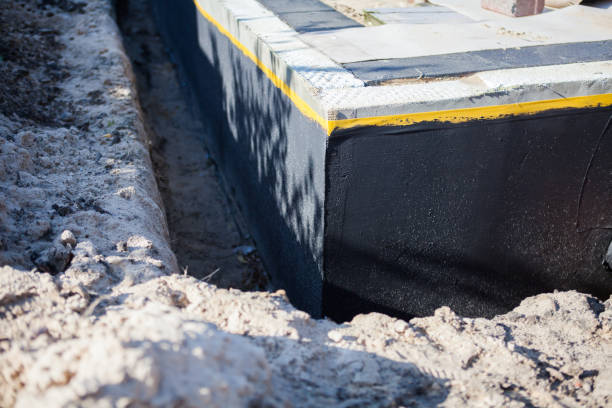 Professional Waterproofing technician working in Hudson, IN